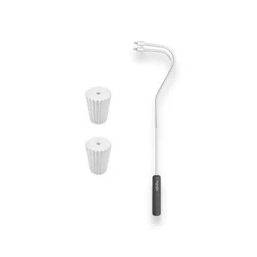 Two filter papers with curved metal pipe tool.