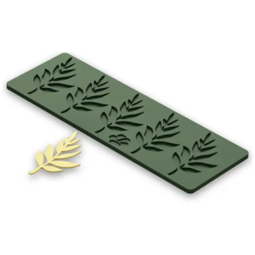 Green leaf pattern silicone mold and yellow cutout.