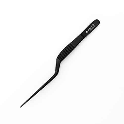 Black eyebrow tweezer on white background.