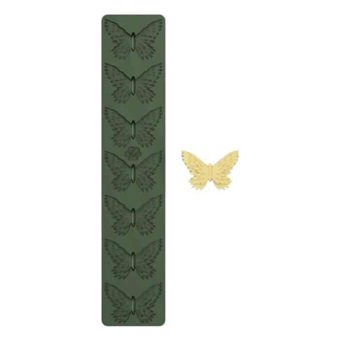 Green butterfly silicone mold with yellow butterfly shape.