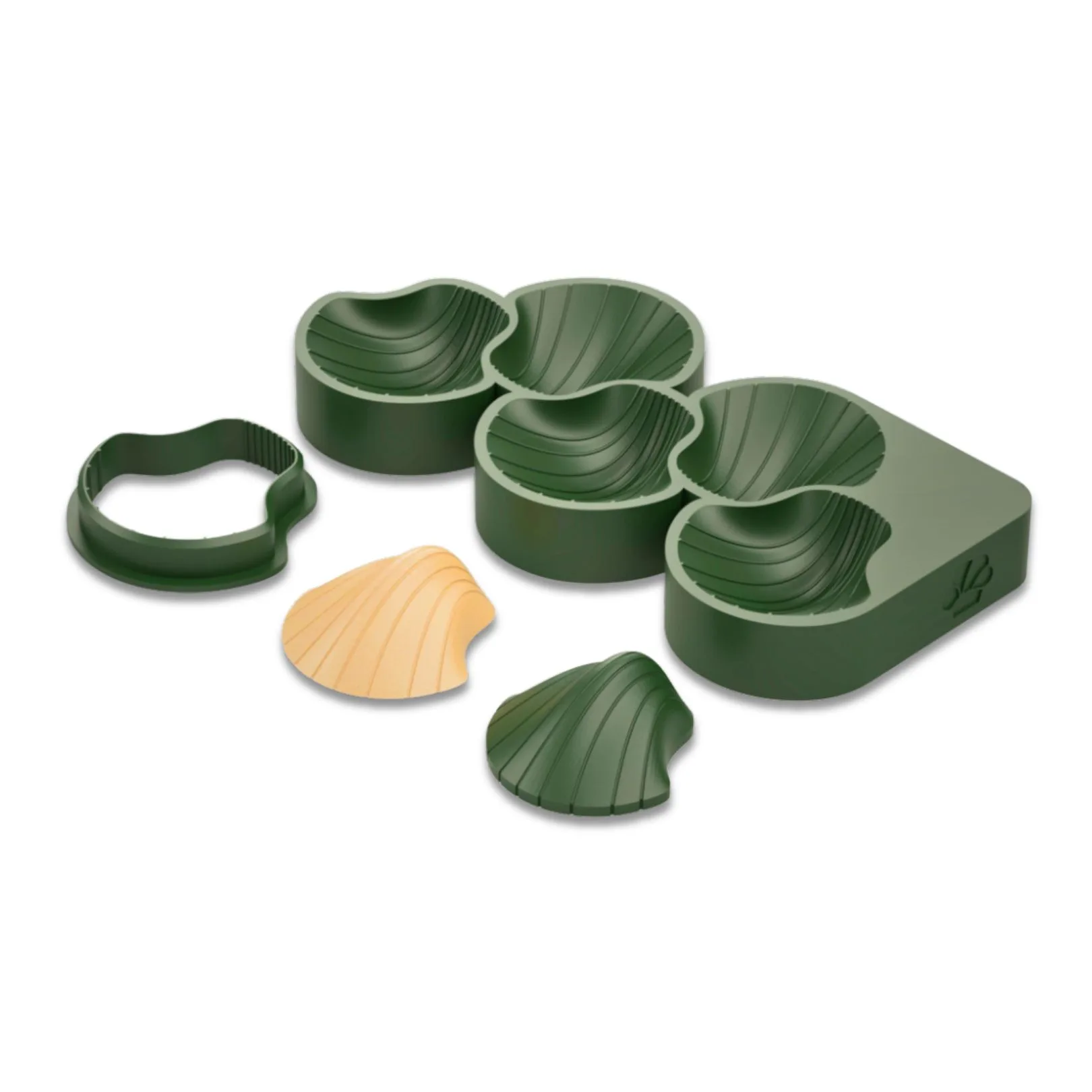 Green cookie cutter set with shell designs.