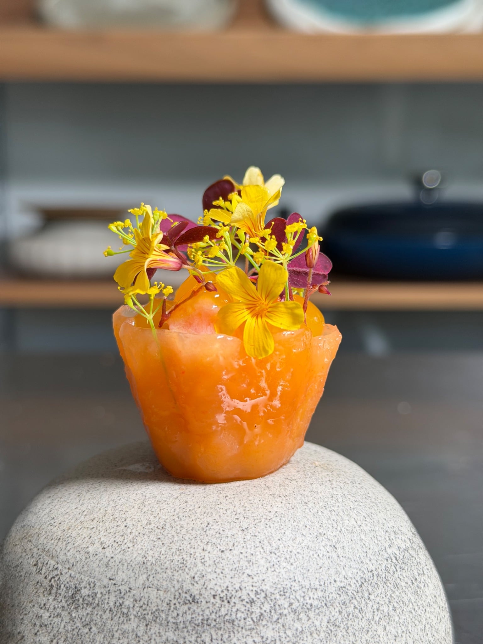 Mango and lime agar agar jelly basket filled with ceviche and edible flowers, by Arnis Ansons